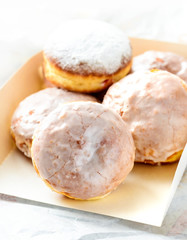 Many donuts in a white box