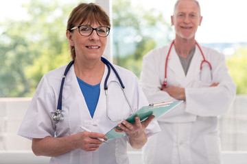 Fototapeta premium Portrait of female and male doctors