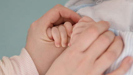 Mother and baby's hands.