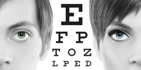blue eyes close up on visual test chart, eyesight and eye examination concept in white background