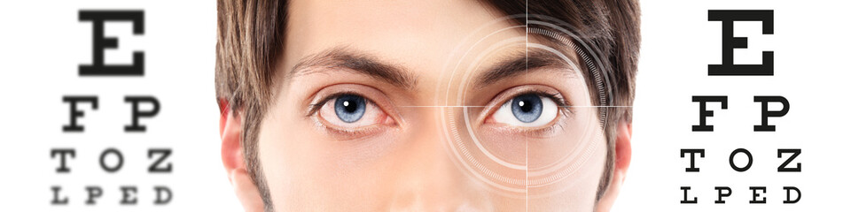 eyes close up on visual test chart, eyesight and eye examination concept in white background