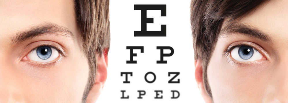 Blue Eyes Close Up On Visual Test Chart, Eyesight And Eye Examination Concept In White Background