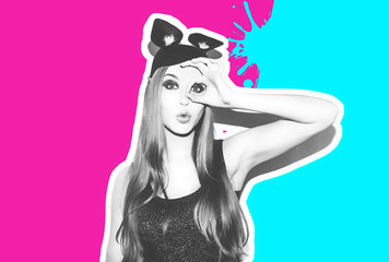 Funny girl represents a small cat or mouse. Woman with a bright makeup hairstyle and night dress mouse ears having fun. On white background not isolated