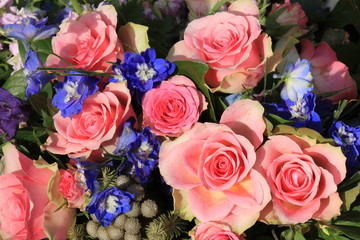 Pink roses and blue larkspur