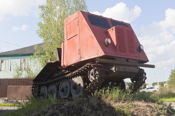 Fototapeta na wymiar Skidder tractor TDT-40 installed as a monument in Veliky Ustyug, Vologda region, Russia