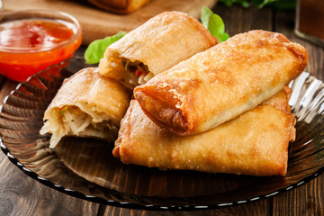 Spring rolls with chicken and vegetables served with sweet chili sauce or soy sauce