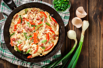 Fresh omelette with bacon and bell pepper