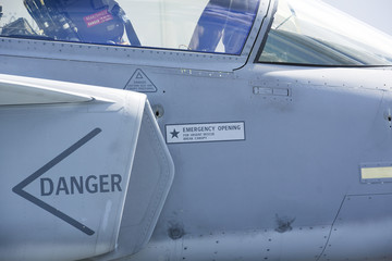 Air intake of a modern jet fighter. Danger text on the intake.