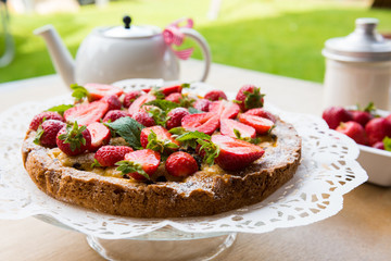 Closeup of a strawberry pie on a table outside