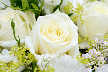 bunch of flowers with white roses