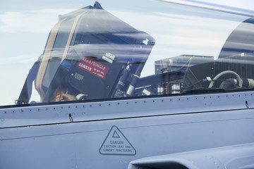 Cockpit of a tactical jet fighter with seat and instructions how to eject from the plane. Danger...