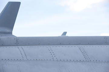 Surface of the modern jet fighter. Screws and metal pieces attached securely.