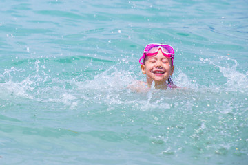 little girl swimming in sea