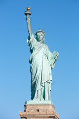 Fototapeta na wymiar Statue of Liberty front view in New York, clear blue sky in a sunny day, clipping path