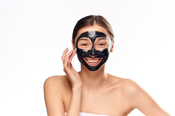 Woman smiling, woman in cosmetic mask for face on isolated background