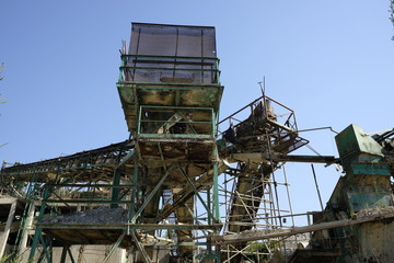 Fototapeta na wymiar Abandoned machinery for gravel extraction