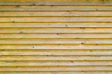 close up of old yellow wooden background texture