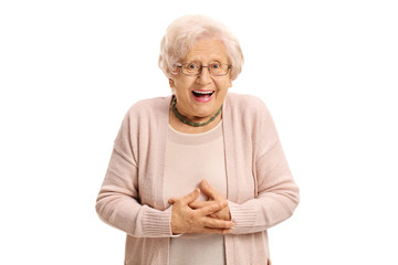 Surprised elderly woman looking at the camera and laughing