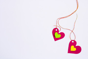 Two connected hearts and two small inside, white background