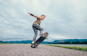Boy makes a trick with skateboard © Soloviova Liudmyla