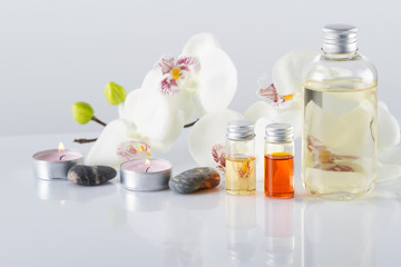 Spa concept. Aroma oil, candles, stones,orchid flowers