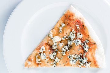 Slice of pizza with dorblu on a plate
