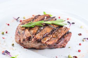 tasty cooked steak on a white plate