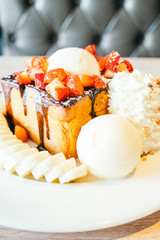 Honey toast with ice cream and strawberry and banana
