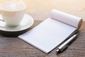 coffee cup clock and news paper on old wooden table nature background