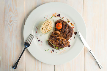 table setting with cooked steak