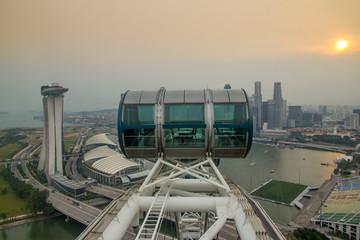 View of Singapore from Singapore Flyer Ferris wheel. Scenic of sunset at Marina Bay