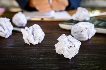 Businessmen stress and Fear Crushed paper on wood table