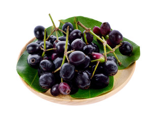 Jambolan plum in wood plate isolated on white background