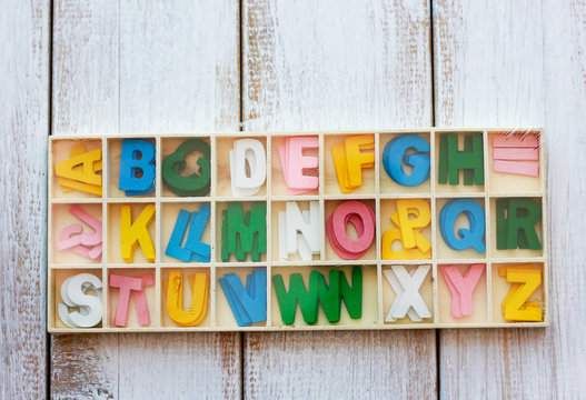 Stock Photo - Colorful wooden English alphabet set on wooden box