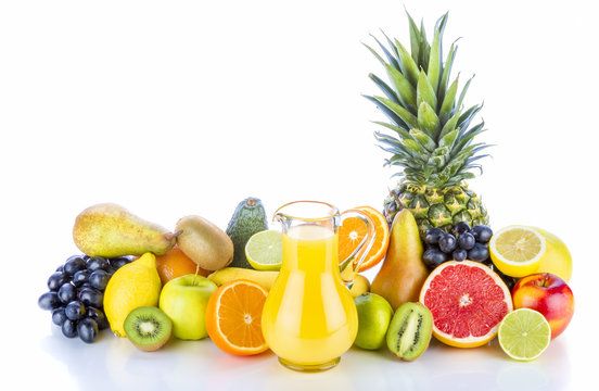 Fruits juice and assortment of exotic fruits on white background. Healthy drink full of vitamins.