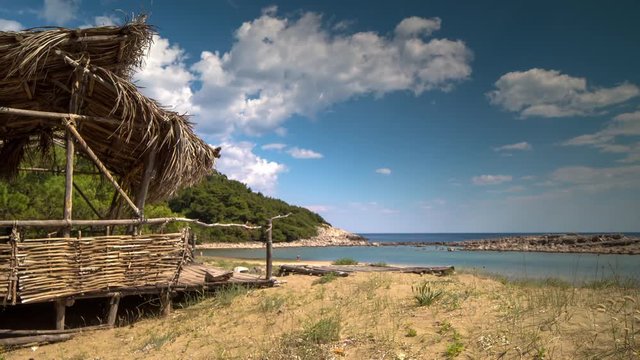 timelapse of a wooden shack on beautiful limoni beach in mljet island, croatia with stunning crystal clear water of the adriatic sea.