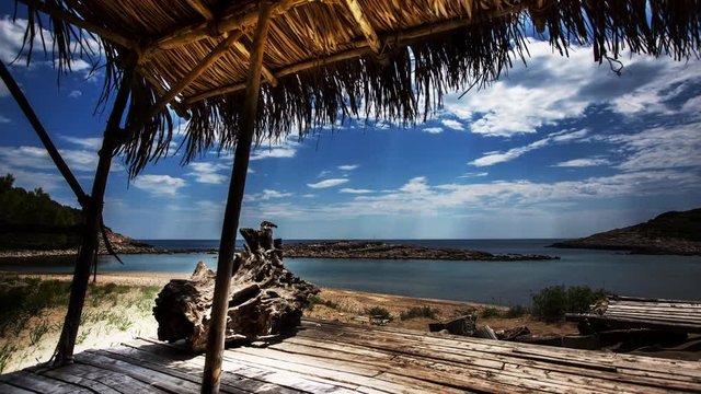 timelapse of a wooden shack on beautiful limoni beach in mljet island, croatia with stunning crystal clear water of the adriatic sea.