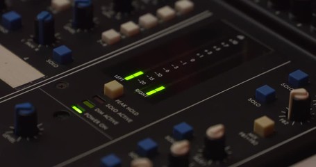1980s audio console, peak level meters output signal of an 18-8-2-channel analog mixing console - Powered by Adobe