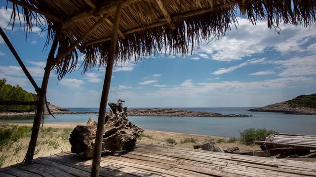 timelapse of a wooden shack on beautiful limoni beach in mljet island, croatia with stunning crystal clear water of the adriatic sea.