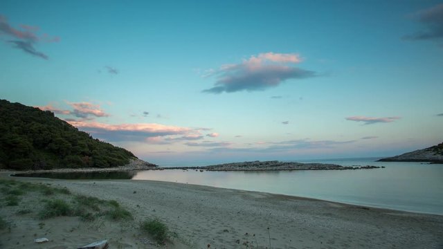 timelapse of a wooden shack on beautiful limoni beach in mljet island, croatia with stunning crystal clear water of the adriatic sea.