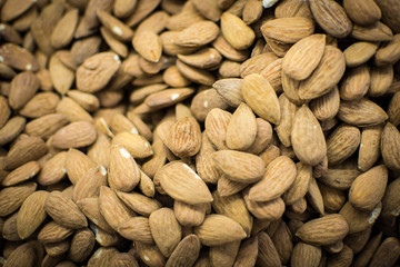 Pile of Almonds Close Up Background. Healthy Eating.
