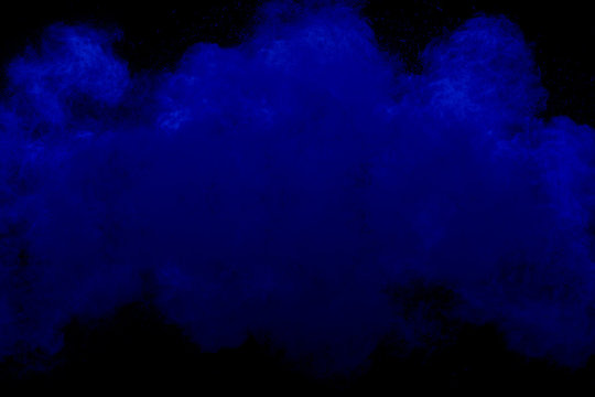 color powder explosion on black background.