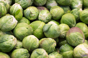 Fototapeta na wymiar Pile of Green Brussels Sprout Close Up Background. Healthy Eating.
