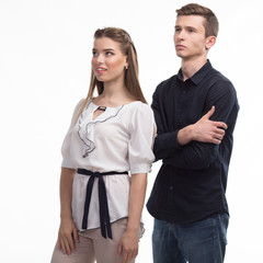 Young happy couple showing presentation pointing on placard over