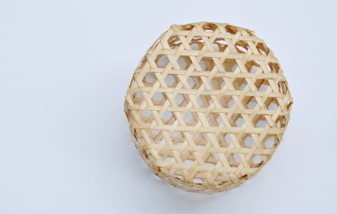 circle woven bamboo basket on white background