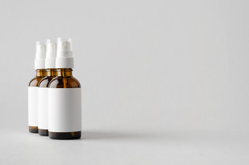 Amber Spray Bottle Mock-Up - Three Bottles. Blank Label