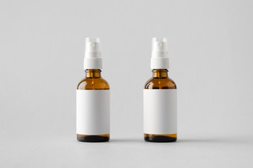 Amber Spray Bottle Mock-Up - Two Bottles. Blank Label