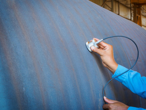 Inspector use ultrasonic testing machine for inspection defect in steel structure.