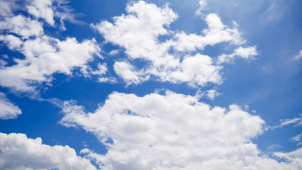 Obraz na płótnie Canvas White clouds on brightly blue sky.