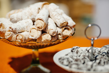 Dessert table at kids birthday party. Cake, candies, marshmallows, cakepops and other sweets